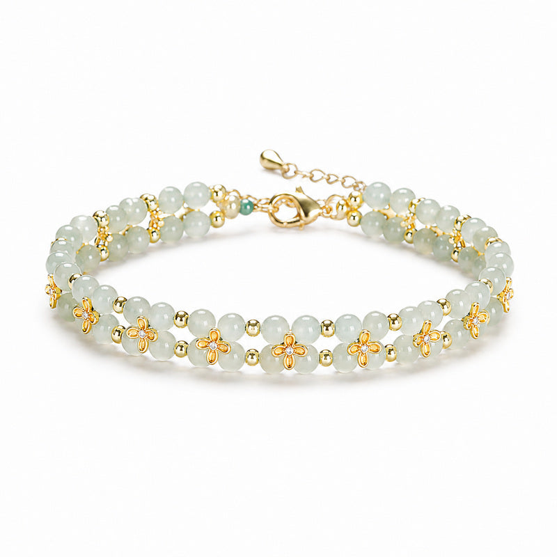 Nephrite jade osmanthus bracelet on centered white background