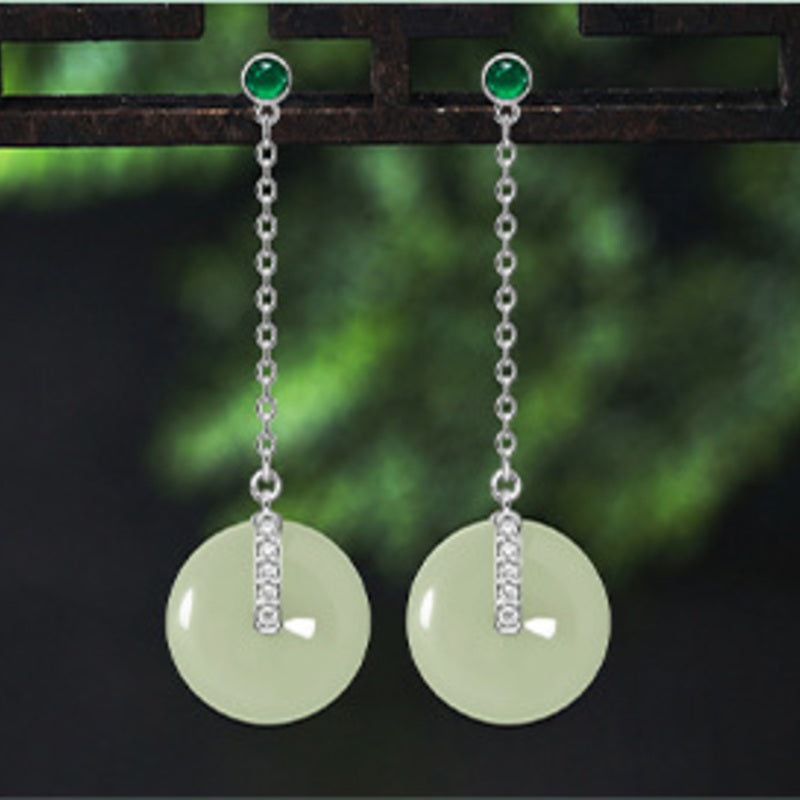 Front view of nephrite jade peace buckle drop earrings