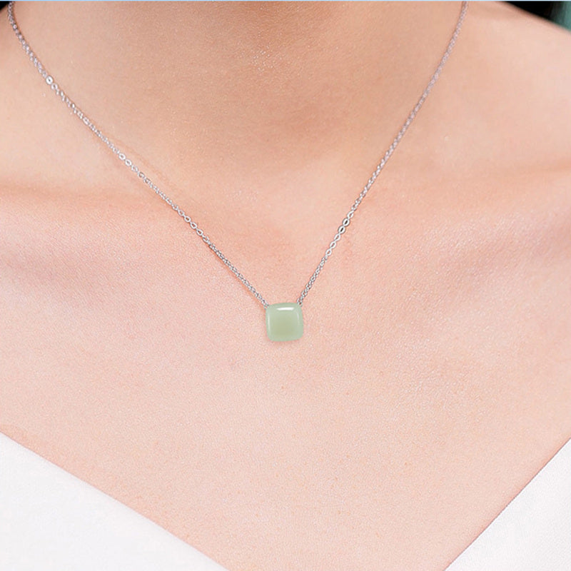Model wearing nephrite jade peace square necklace