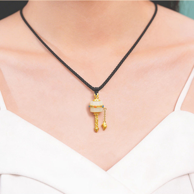 Model wearing Nephrite Jade prayer wheel pendant