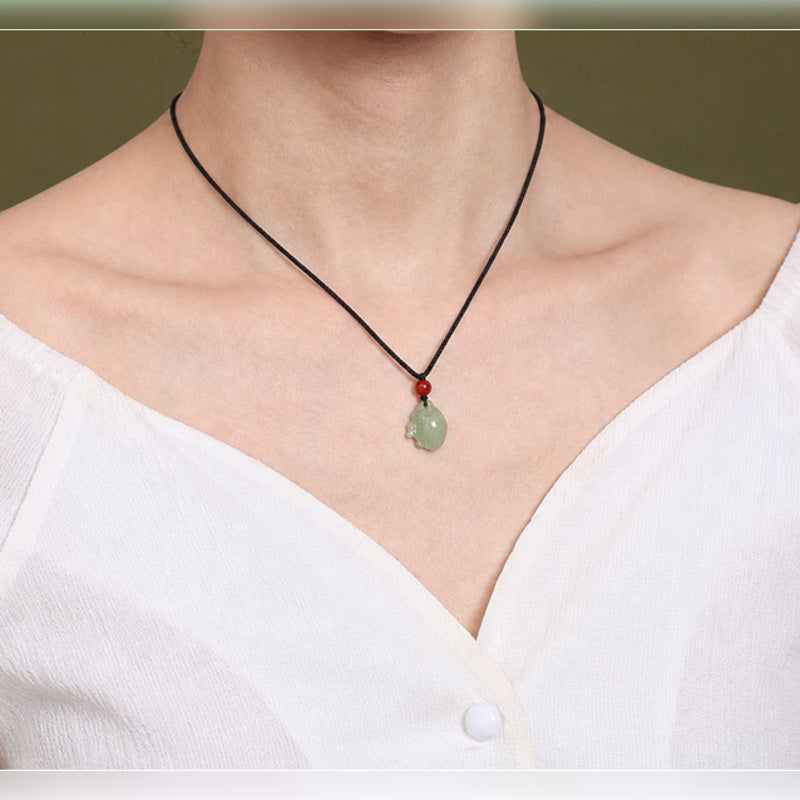 Model wearing a Nephrite Jade zodiac rabbit pendant