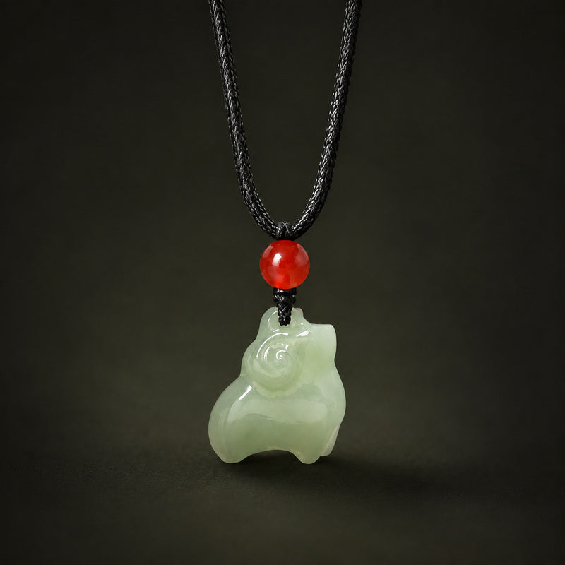 Nephrite jade Zodiac Sheep pendant on a dark background