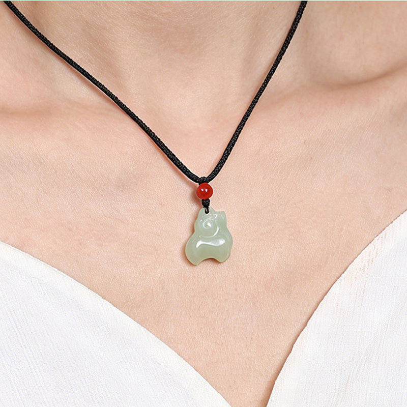 Model wearing the nephrite jade Zodiac Sheep pendant