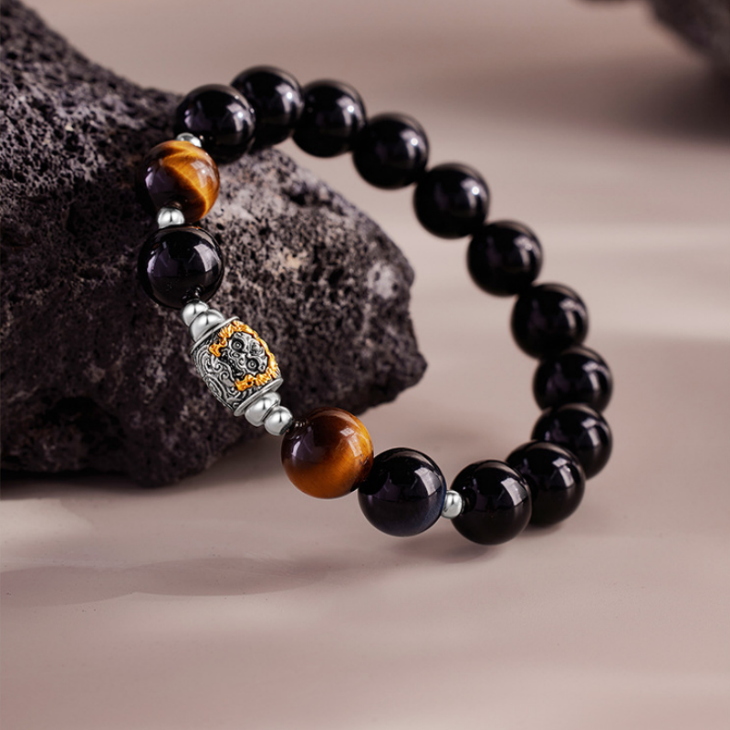 Angled view of the Qilin spacer and tiger eye beads