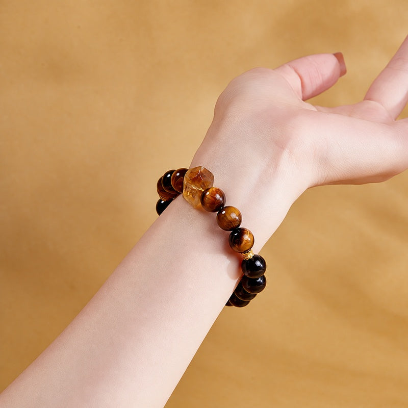 Supplier model wearing the stretch bracelet with yellow quartz centerpiece