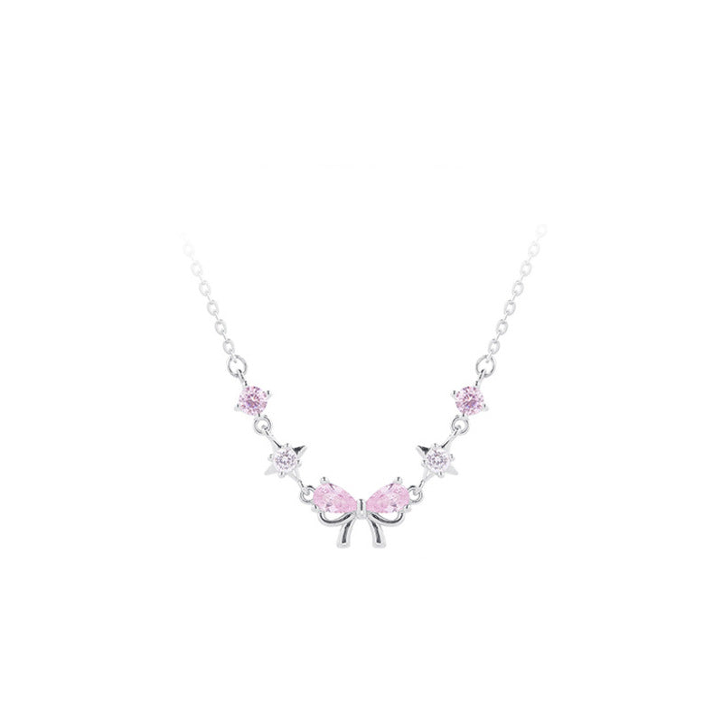 Original white-background front view of the pink bow necklace