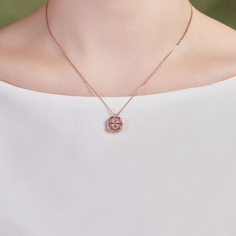 Model wearing the closed pink clover necklace