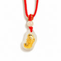 Red cord nephrite jade Pixiu pendant on white background