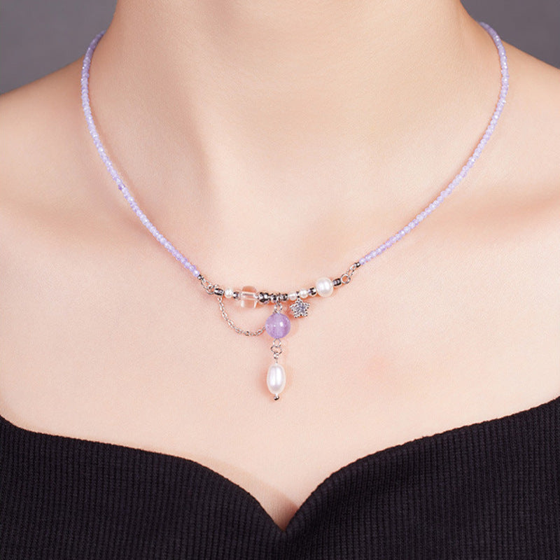 Front model view wearing amethyst pearl drop necklace