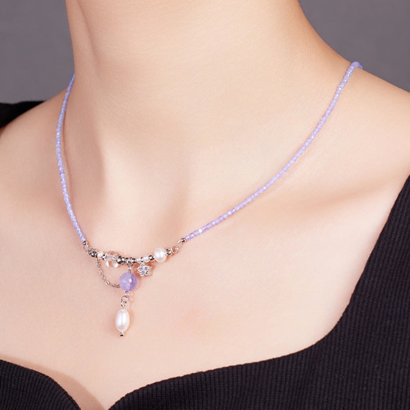 Side model view wearing pale purple gemstone necklace