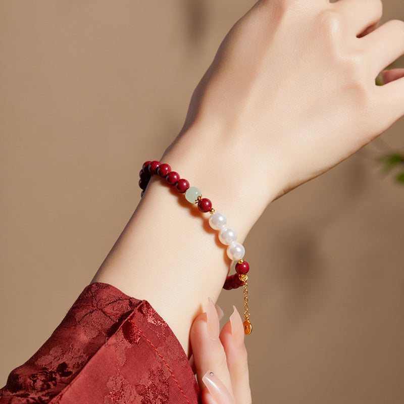 Purple gold sand and pearl bracelet worn on wrist
