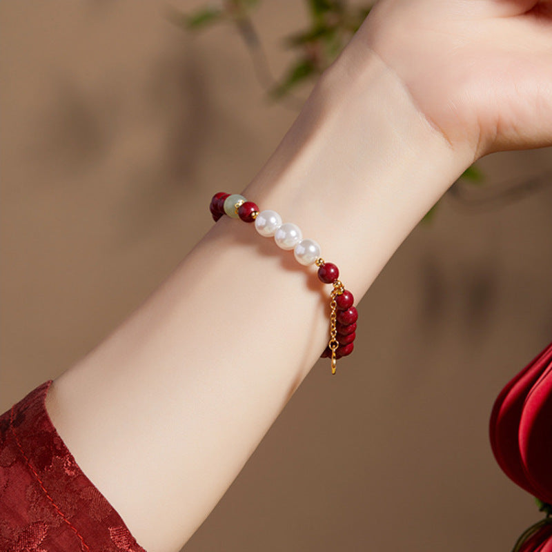 Nephrite pearl and purple gold sand bracelet on wrist