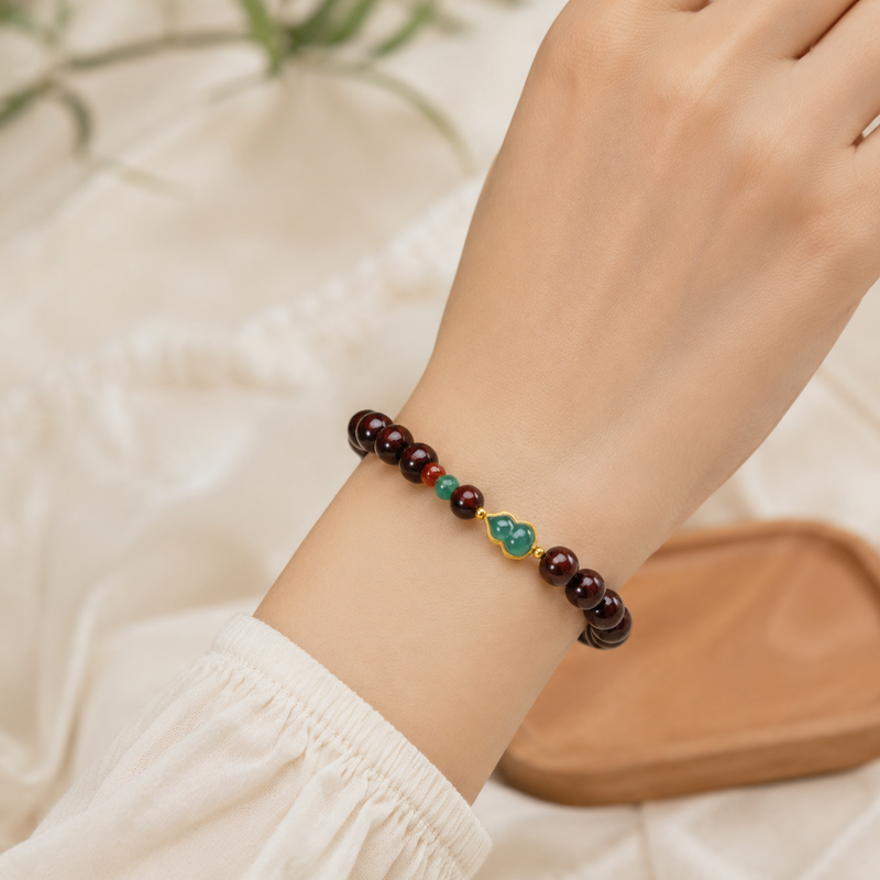 Female model wearing purple sandalwood jade gourd bracelet