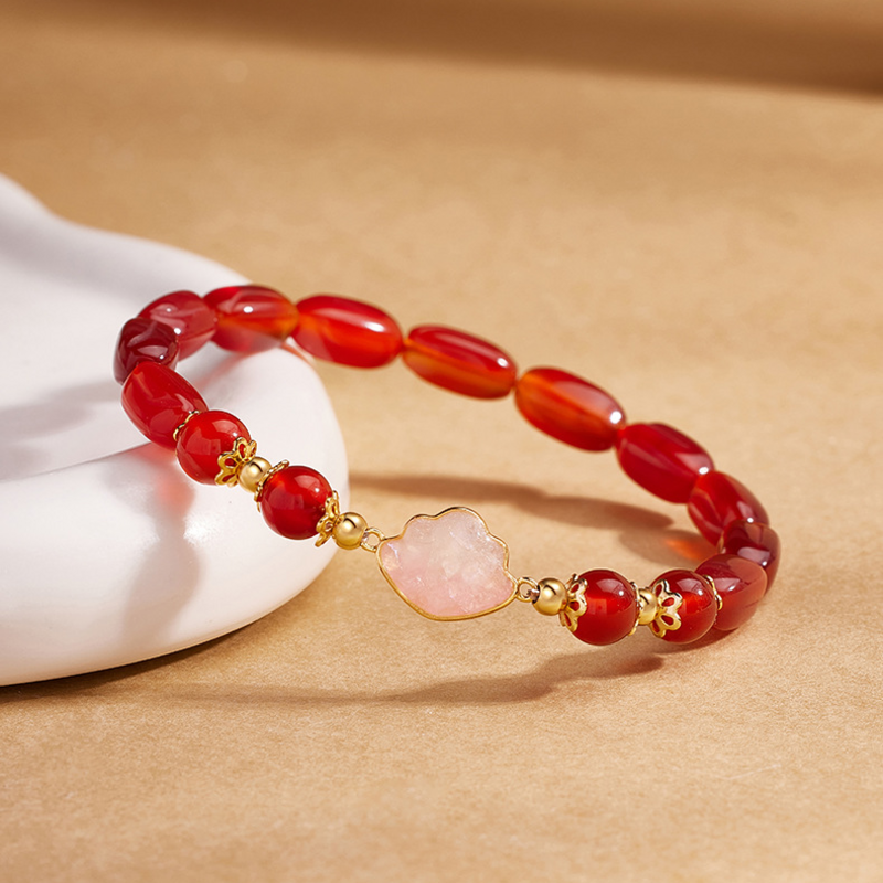 Angled close view of red agate bracelet centerpiece