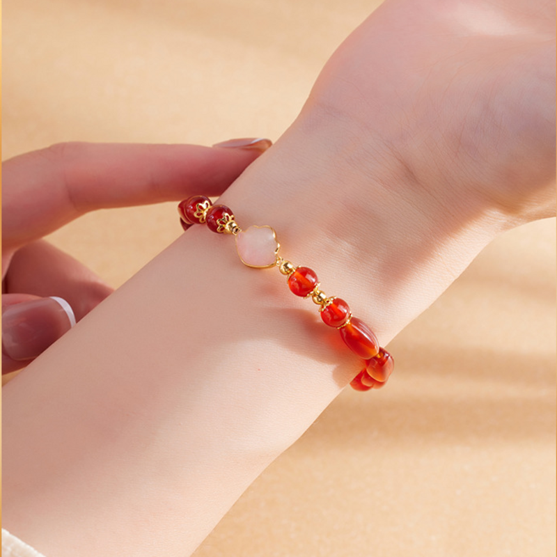 Red agate bracelet wrist detail with cloud centerpiece