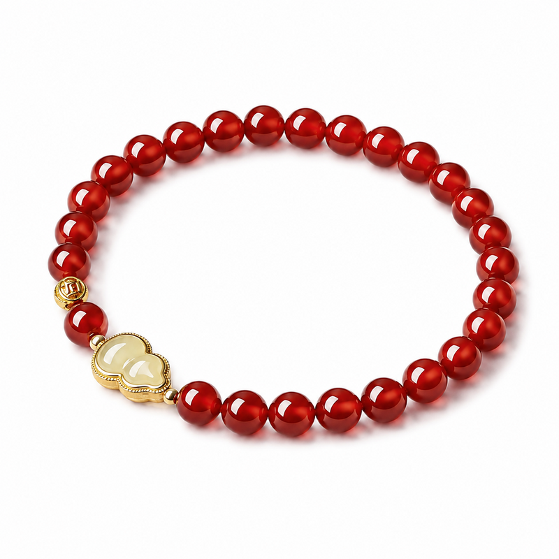 Red agate bracelet with Hetian jade gourd on white background