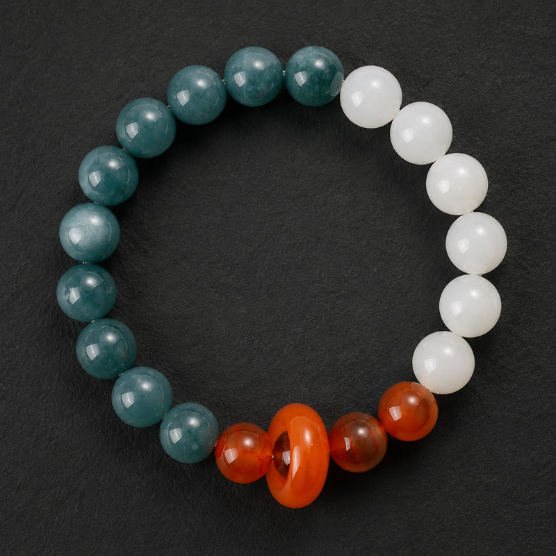 Blue Water Jade bracelet with one Red Agate sliding donut on black