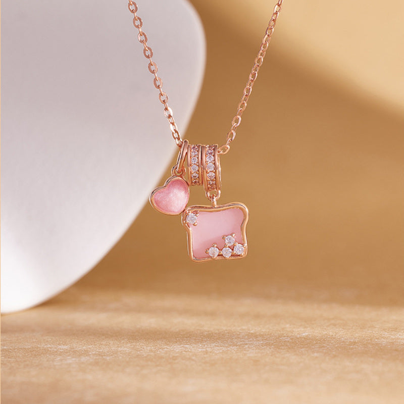 Rose gold tone toast heart necklace angled detail