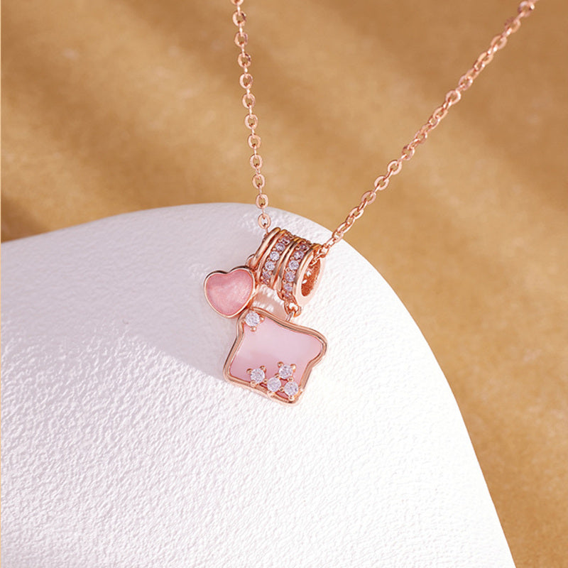 Pink shell toast heart necklace styled front view