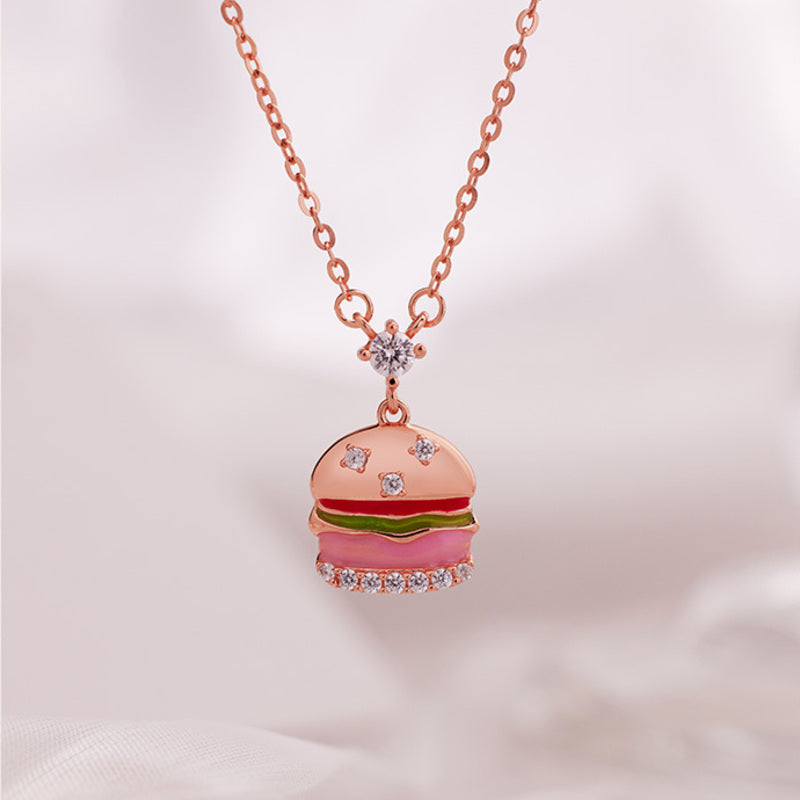 S925 silver burger pendant necklace on soft pink background