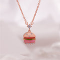 S925 silver burger pendant necklace on soft pink background