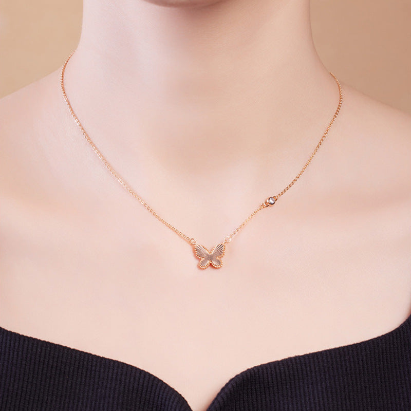 Model wearing an S925 silver textured butterfly necklace