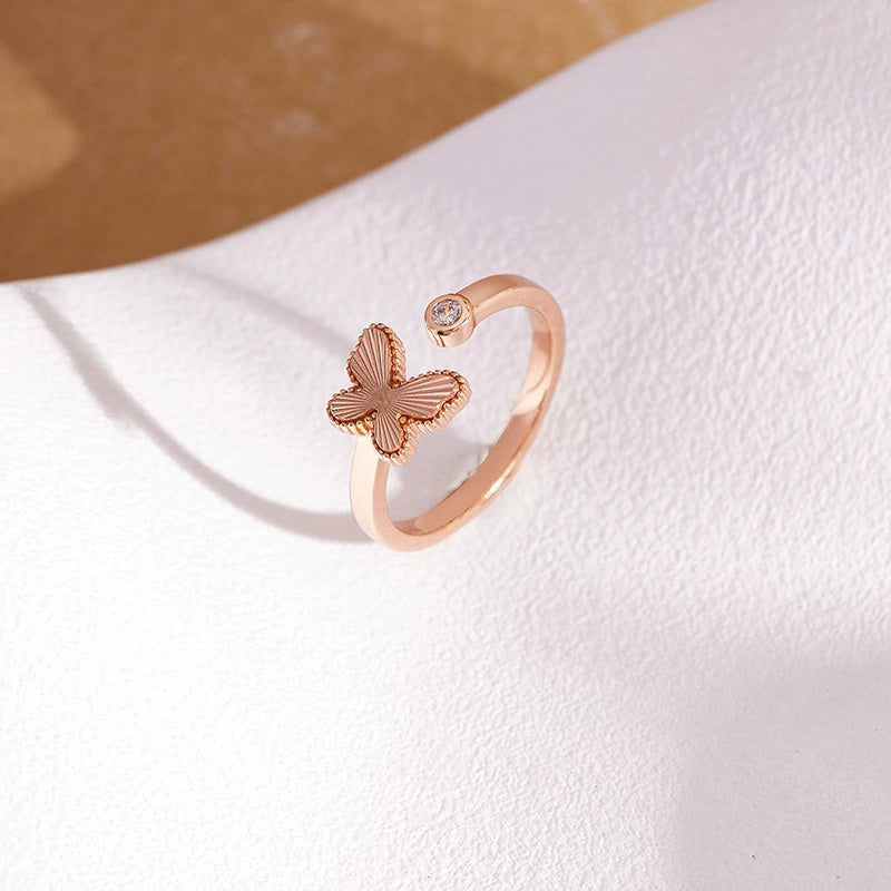 S925 silver textured butterfly adjustable open ring on warm paper