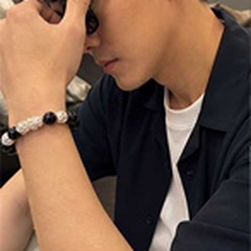 Model wearing the black beaded snake bracelet