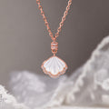 White mother-of-pearl shell necklace on a soft gray background