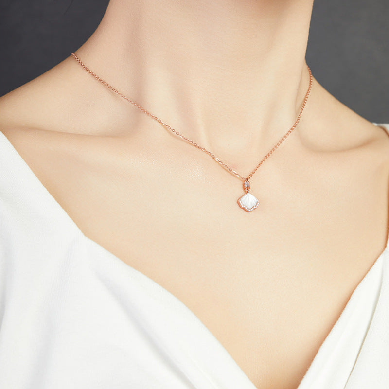 Original side view of model wearing necklace
