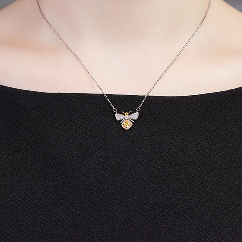 Original model wearing the silver bee necklace