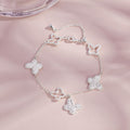 Sterling silver butterfly bracelet on pink background