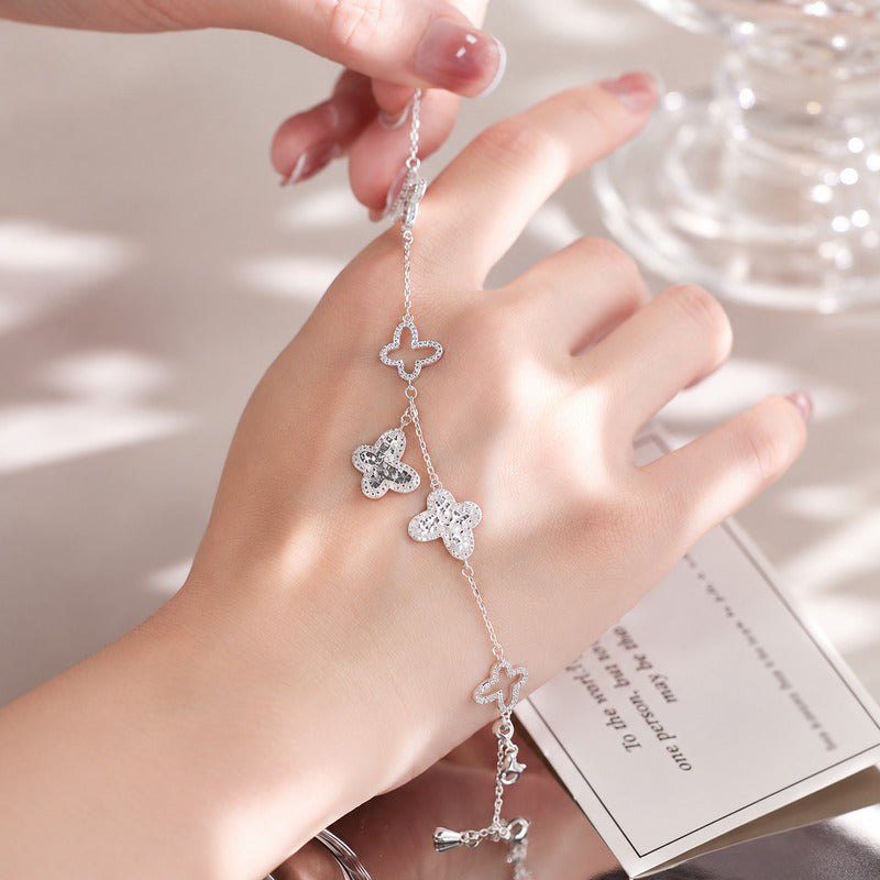 Silver butterfly bracelet - hand-held detail