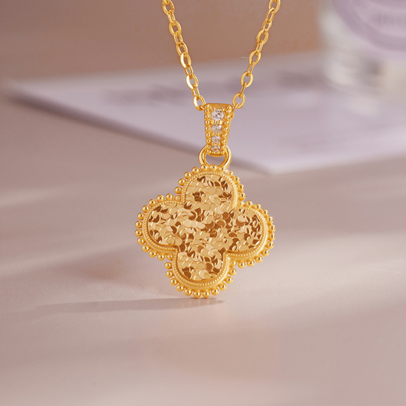 Angled view of the silver clover pendant and cubic zirconia accents