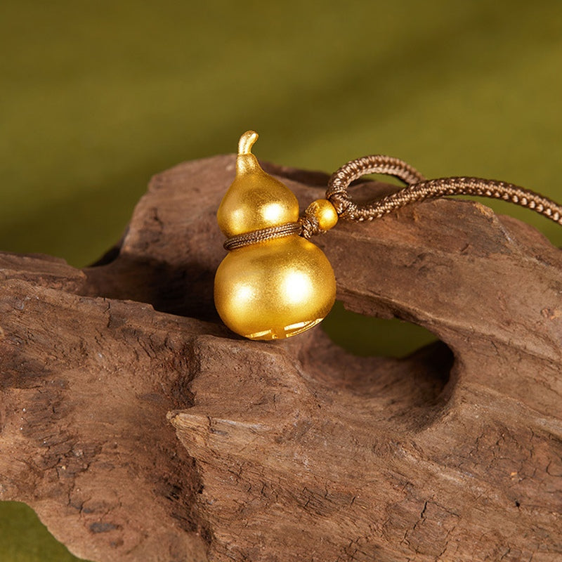 Alternate view of the gourd pendant and braided cord