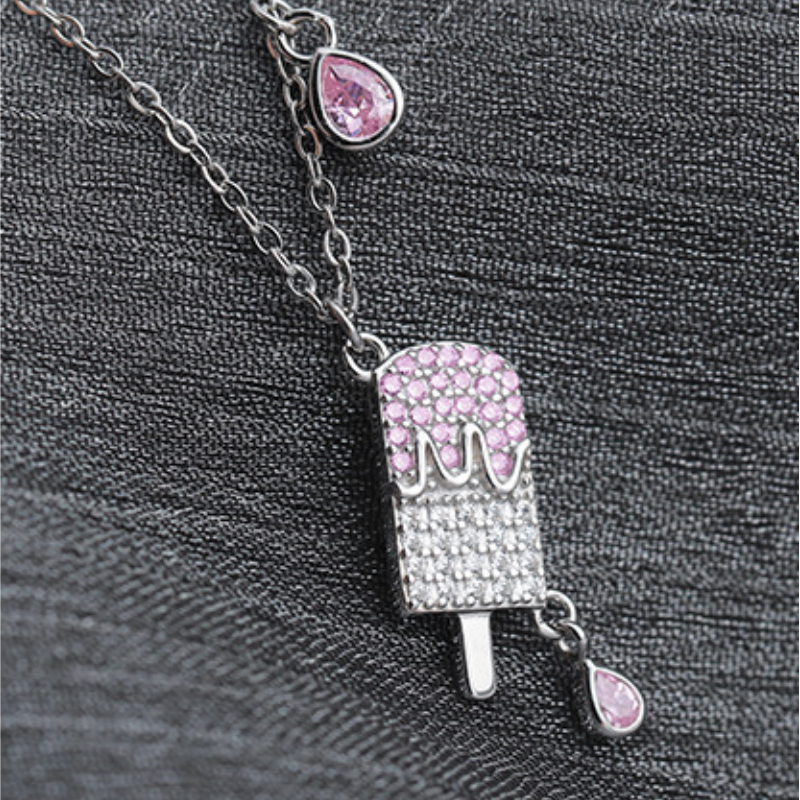 Close view of the pink-topped silver popsicle pendant and teardrop details
