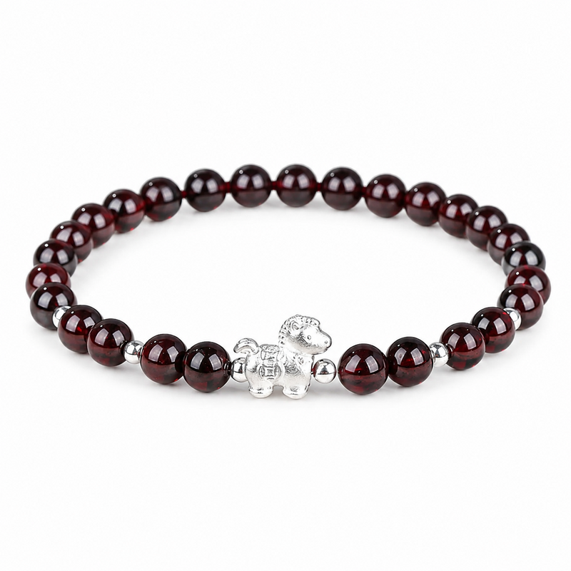 Sterling silver lucky horse garnet bracelet on a clean white background