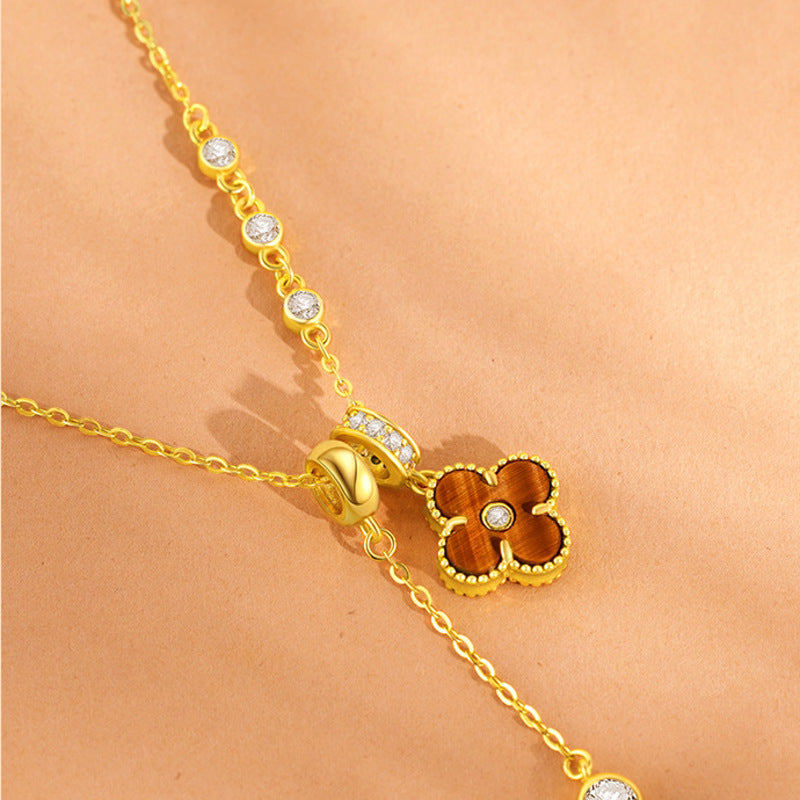 Close view of Tiger's Eye clover and Cubic Zirconia accents