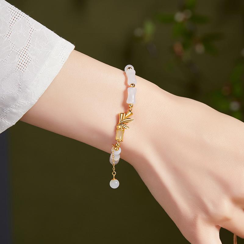 Original supplier model wearing the bamboo bracelet, alternate wrist angle
