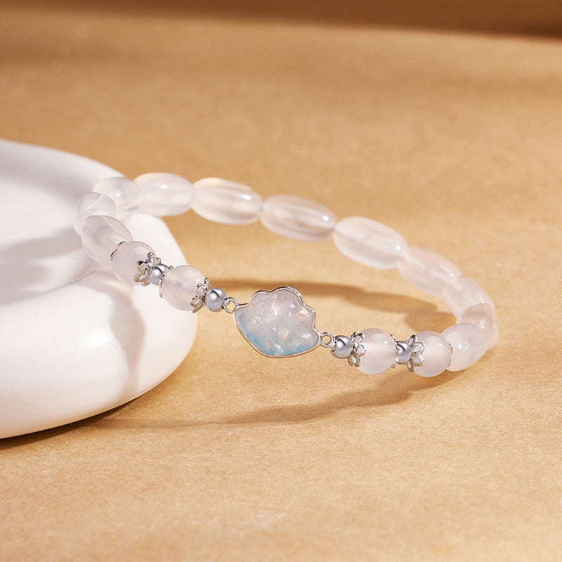 Cloud centerpiece and chalcedony beads in angled jewelry detail
