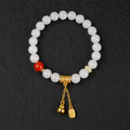 White jade gourd agate bracelet on dark stone
