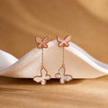 White mother-of-pearl butterfly drop earrings front view