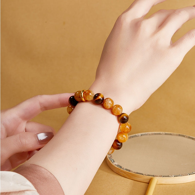 Close view of yellow quartz bracelet styled on a wrist