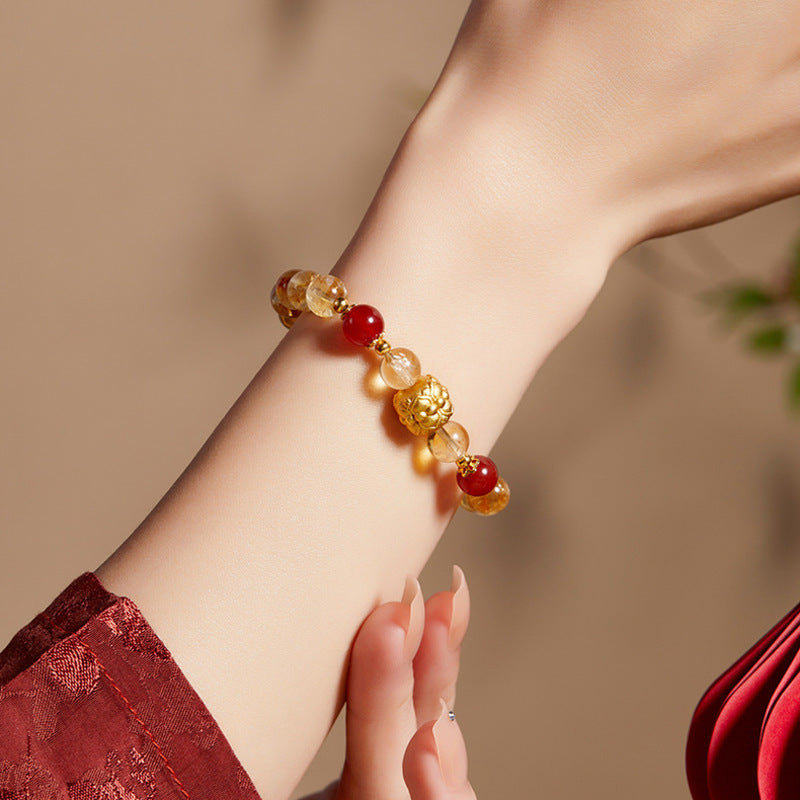 Original model wearing yellow tower quartz and red agate lotus bracelet