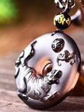 Round ice obsidian Tiger zodiac pendant close-up
