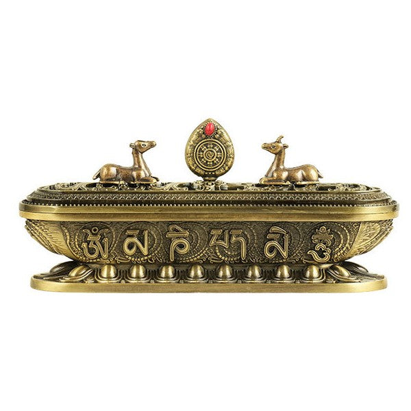 Antique bronze incense burner isolated on white, showing long rectangular form and raised ornamental lid