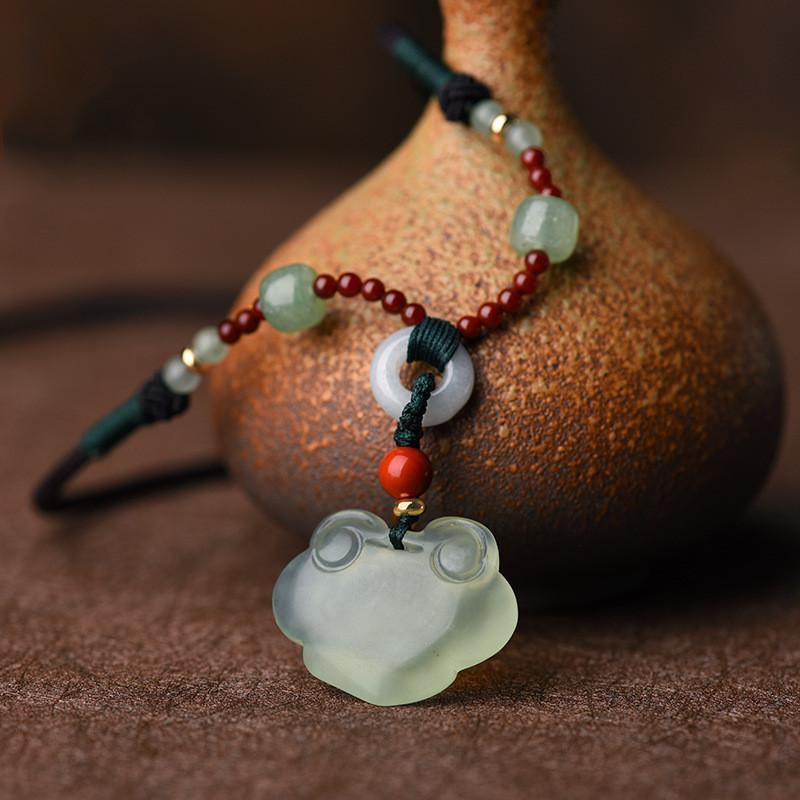 Auspicious Clouds Green Jade Wealth Pendant - FengshuiGallary