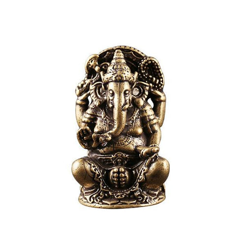 Antique brass Ganesha wealth statue seated on lotus base against a white background