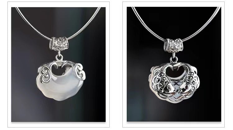 Front and back views of pale jade koi fish pendant with ornate silver framing