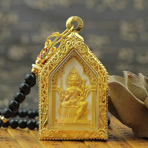 Four faced Thai Buddha amulet in an ornate house shaped gold frame with black beads